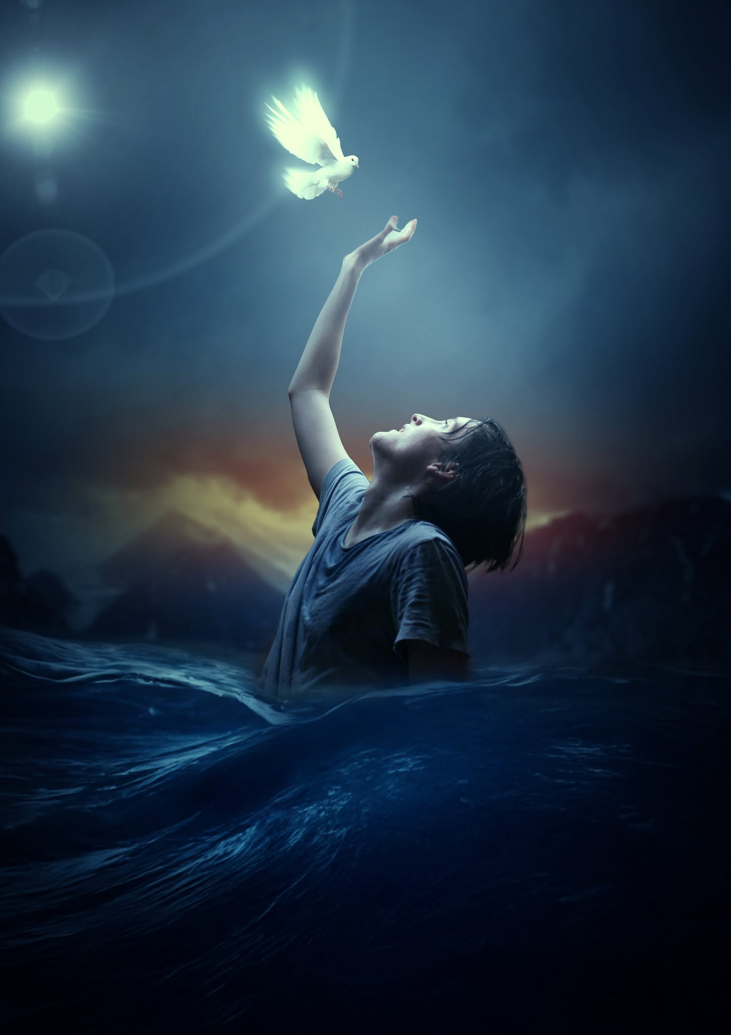 Photo composite: a boy waist-deep in dark water reaching up to a glowing white dove
